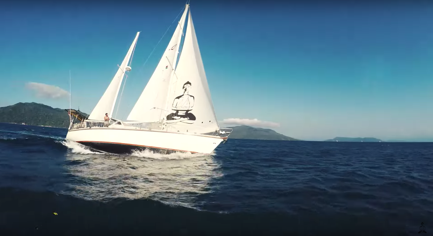He quit to sail the world for his YouTube Sailing SV Delos 